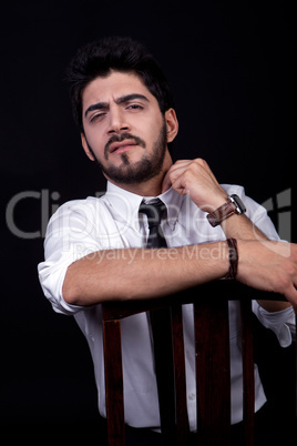 young successful business man with a suit isolated on black background