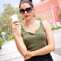 attractive woman with sunglasses in the city summertime