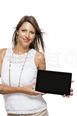 Woman chatting on a mobile while reading a tablet