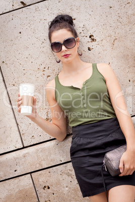 attractive young woman with smartphone and sunglasses outdoor