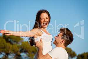 attractive couple in love summertime on beach