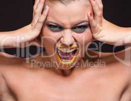 attractive young woman scream out loud with yellow lipstick