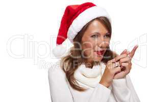 Attractive smiling woman in a Santa hat