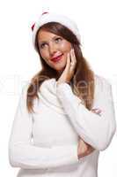 Attractive woman wearing a festive red Santa hat