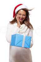 Beautiful vivacious woman with a Christmas gift