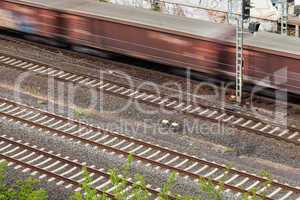 Fast moving train with red stripe