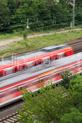 Fast moving train with red stripe