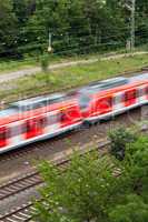 Fast moving train with red stripe