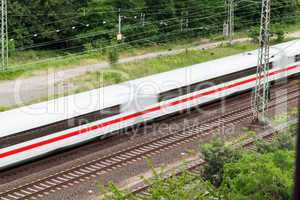 Fast moving train with red stripe