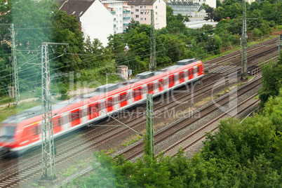 Fast moving train with red stripe