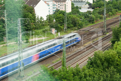 Fast moving train with red stripe