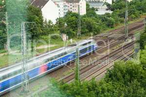 Fast moving train with red stripe