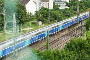 Fast moving train with red stripe