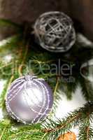 Silver Christmas ornaments in leaves