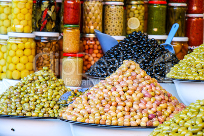 Olives and pickles on display at a farmers market