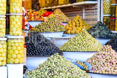 Olives and pickles on display at a farmers market