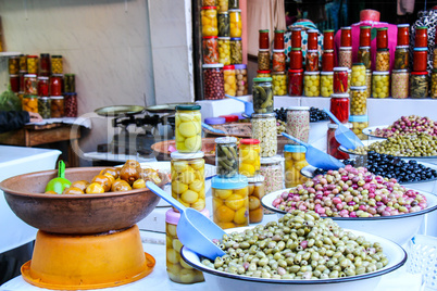 Olives and pickles on display at a farmers market