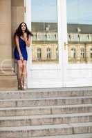 beautiful brunette woman in blue dress outdoor