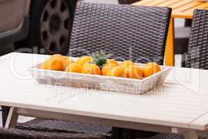 fresh orange fruits decorative on table in summer