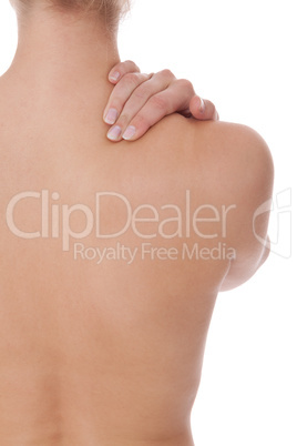 Woman caressing her bare shoulder and back