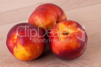 Three tasty fresh ripe juicy nectarines