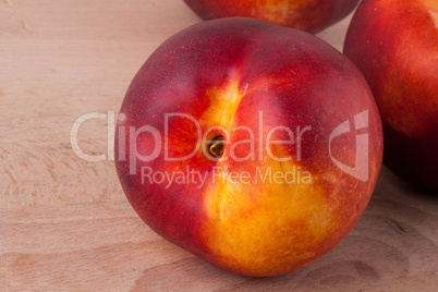 Three tasty fresh ripe juicy nectarines