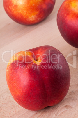 Three tasty fresh ripe juicy nectarines