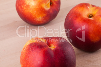 Three tasty fresh ripe juicy nectarines