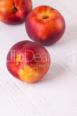 Three tasty fresh ripe juicy nectarines