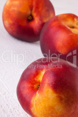 Three tasty fresh ripe juicy nectarines