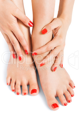 Woman with beautiful red finger and toenails