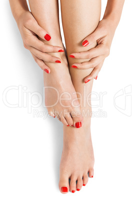 Woman with beautiful red finger and toenails