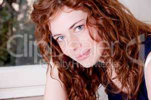 beautiful red head woman with freckle smiling