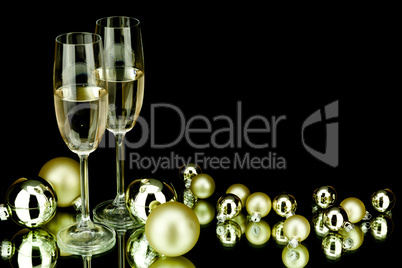 christmas decoration and champagne on black