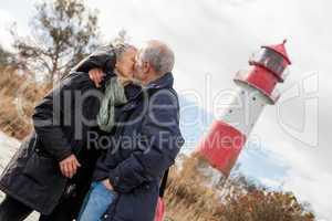 happy mature couple relaxing baltic sea dunes