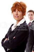 red head woman in business outfit  front man  background