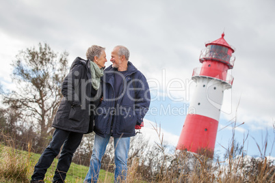 happy mature couple relaxing baltic sea dunes