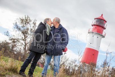 happy mature couple relaxing baltic sea dunes