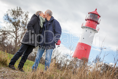 happy mature couple relaxing baltic sea dunes