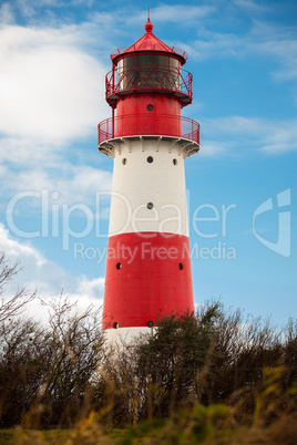 landscape baltic sea dunes lighthouse in red and white