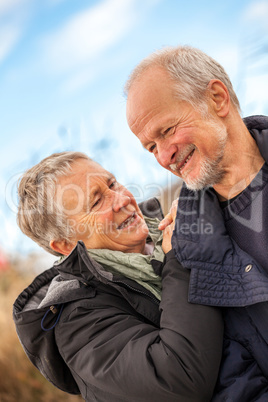 happy mature couple relaxing baltic sea dunes