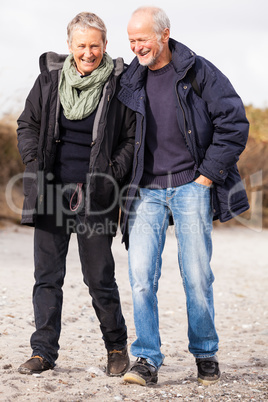 happy mature couple relaxing baltic sea dunes