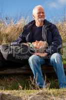 happy senior couple relaxing together in the sunshine