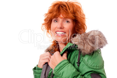 adult redhead woman with winter jacket smiling isolated