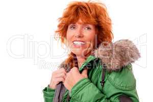 adult redhead woman with winter jacket smiling isolated