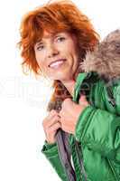 redhead smiling adult mature woman with geen warm jacket