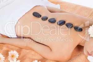 attractive healthy caucasian woman hot stone massage wellness