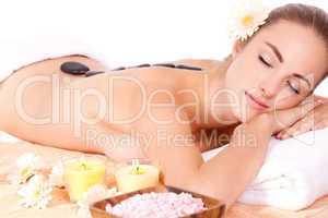 young attractive woman hot stone massage wellness isolated