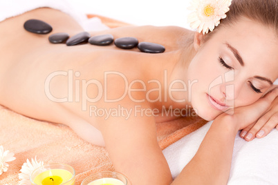 young attractive woman hot stone massage wellness isolated