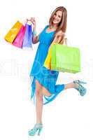 attractive young woman with colorful shopping bags isolated